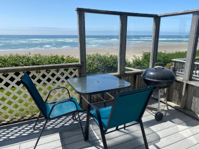 Deck with Patio Table and Chairs and Webber BBQ